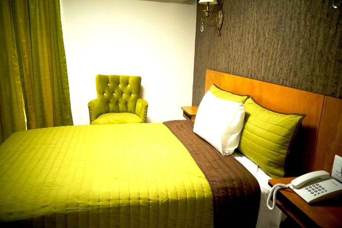 Imagen de la habitación del Hotel Royal Madero Inn. Foto 11