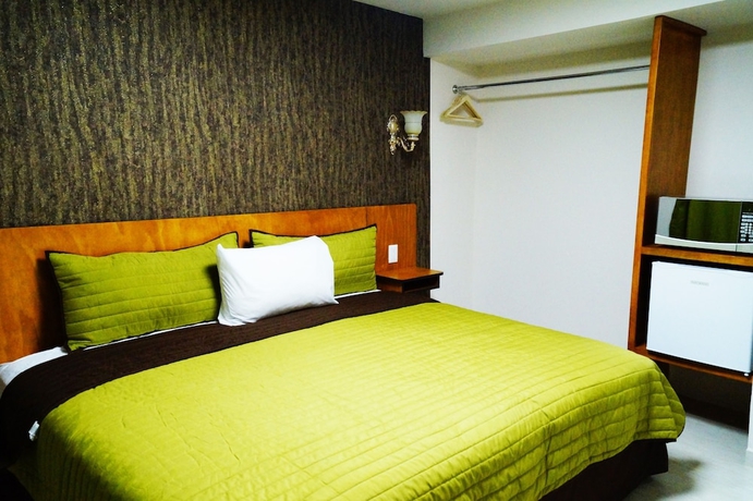 Imagen de la habitación del Hotel Royal Madero Inn. Foto 17