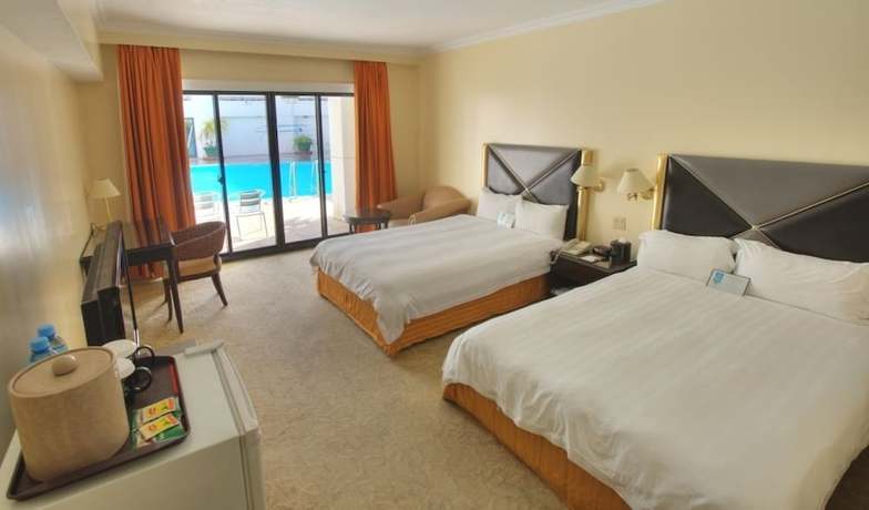 Imagen de la habitación del Hotel Royal Orchid Guam. Foto 9