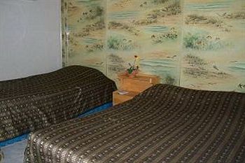 Imagen de la habitación del Hotel Royal Orchid Resort. Foto 6