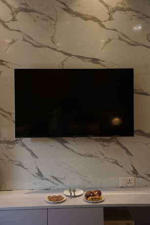 Imagen del bar/restaurante del Hotel Royal Residence HUDA City Centre, Gurugram. Foto 4