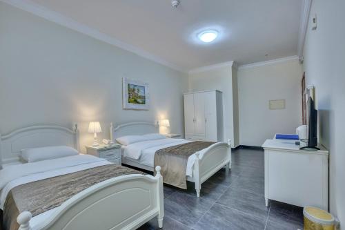 Imagen de la habitación del Hotel Royal, Sharjah. Foto 18