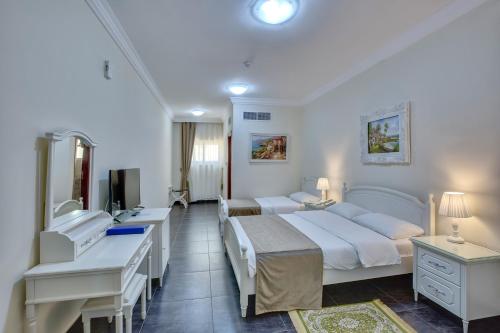 Imagen de la habitación del Hotel Royal, Sharjah. Foto 19