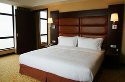 Imagen de la habitación del Hotel Royal Tulip On The Beach Shanghai. Foto 4