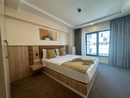 Imagen de la habitación del Hotel Roys & Suites. Foto 18