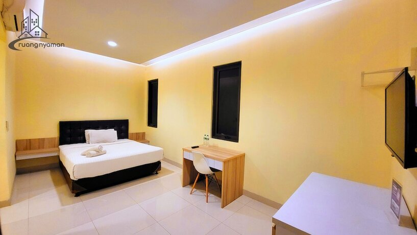 Imagen de la habitación del Hotel Ruang Nyaman at Regentown near ICE BSD. Foto 17
