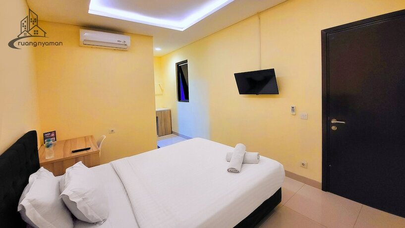 Imagen de la habitación del Hotel Ruang Nyaman at Regentown near ICE BSD. Foto 18
