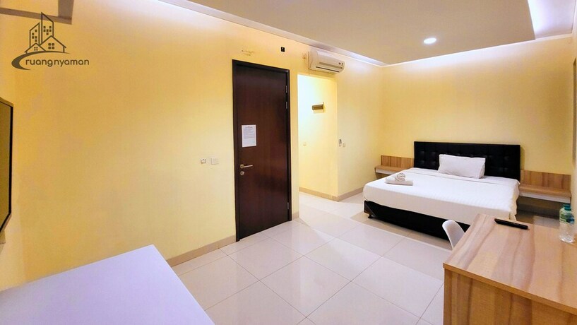 Imagen de la habitación del Hotel Ruang Nyaman at Regentown near ICE BSD. Foto 20