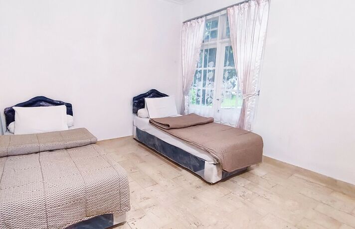 Imagen de la habitación del Hotel Ruang Nyaman at Sukanagalih Resort. Foto 15