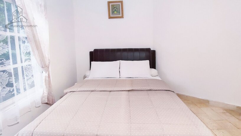 Imagen de la habitación del Hotel Ruang Nyaman at Sukanagalih Resort. Foto 16