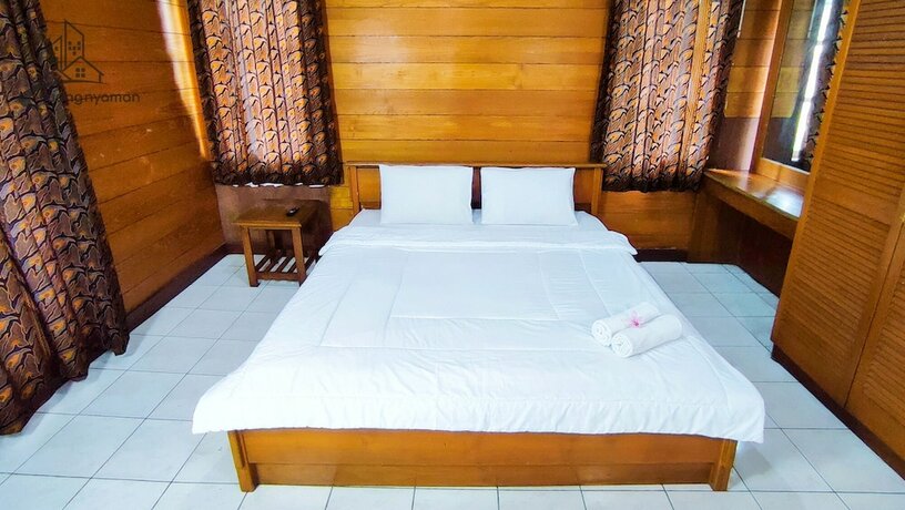 Imagen de la habitación del Hotel Ruang Nyaman at Sukanagalih Resort. Foto 18