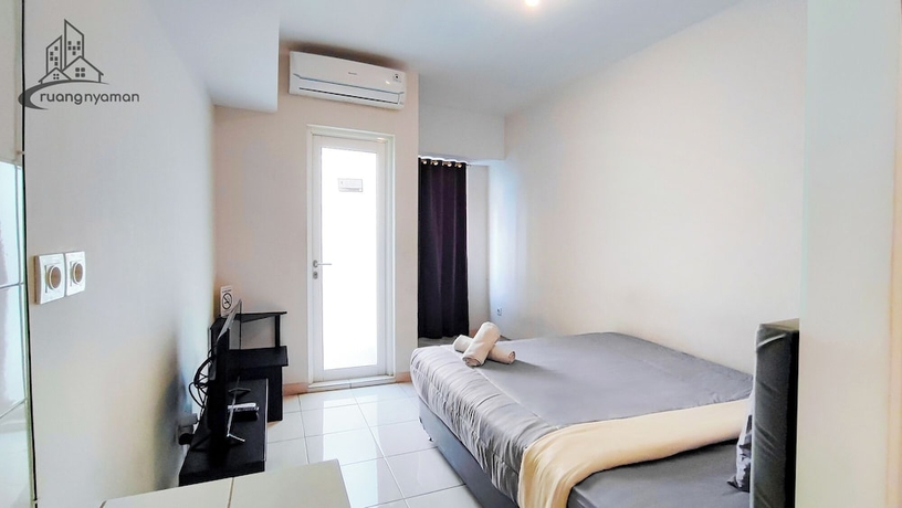 Imagen de la habitación del Hotel Ruang Nyaman at The Springlake Summarecon Bekasi. Foto 7