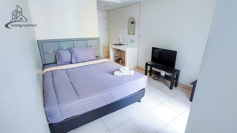 Imagen de la habitación del Hotel Ruang Nyaman at The Springlake Summarecon Bekasi. Foto 8