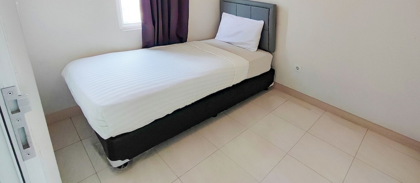 Imagen de la habitación del Hotel Ruang Nyaman at The Springlake Summarecon Bekasi. Foto 9