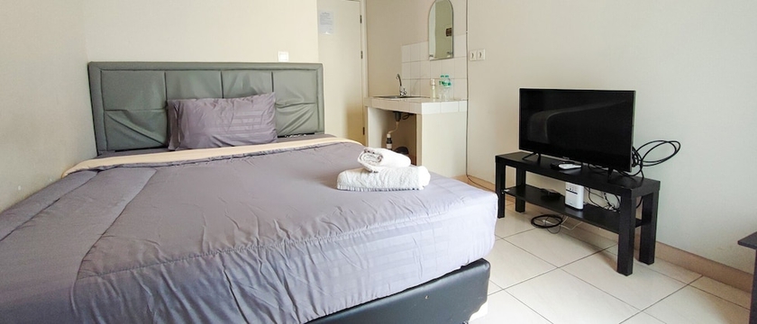 Imagen de la habitación del Hotel Ruang Nyaman at The Springlake Summarecon Bekasi. Foto 10