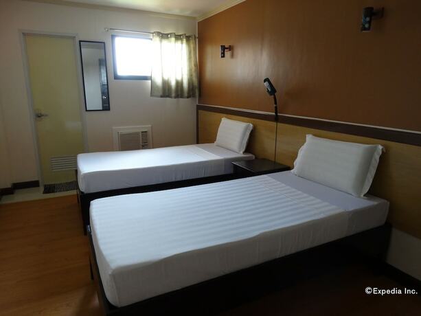 Imagen de la habitación del Hotel RueMango Apartelle and Suites. Foto 14