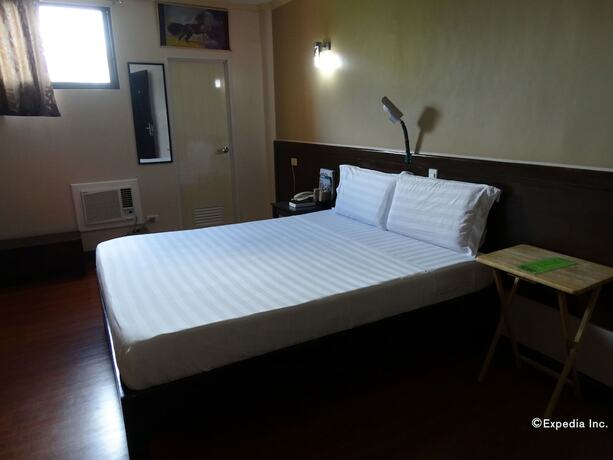 Imagen de la habitación del Hotel RueMango Apartelle and Suites. Foto 15