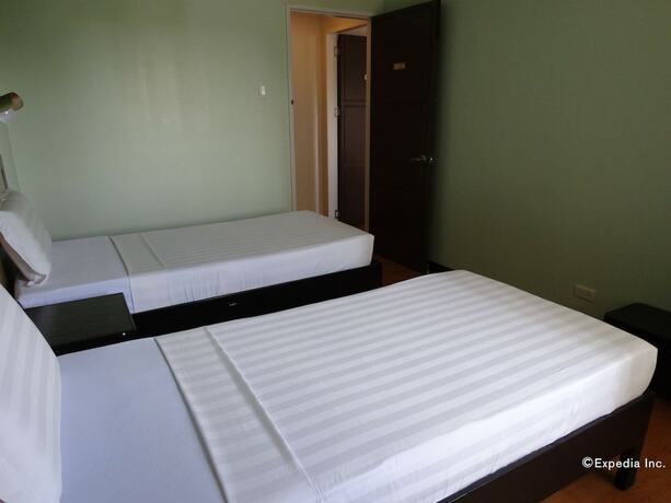 Imagen de la habitación del Hotel RueMango Apartelle and Suites. Foto 16