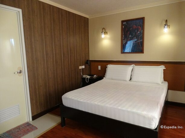 Imagen de la habitación del Hotel RueMango Apartelle and Suites. Foto 17
