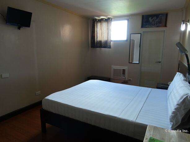 Imagen de la habitación del Hotel RueMango Apartelle and Suites. Foto 18