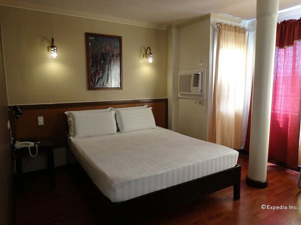 Imagen de la habitación del Hotel RueMango Apartelle and Suites. Foto 19