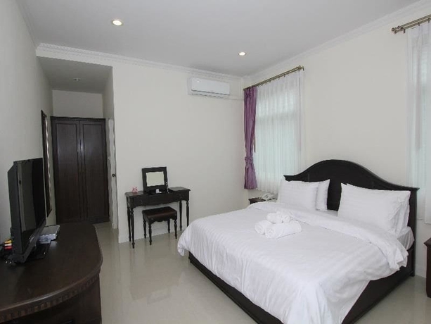 Imagen de la habitación del Hotel Ruen Maihom Riverside Cottage. Foto 7