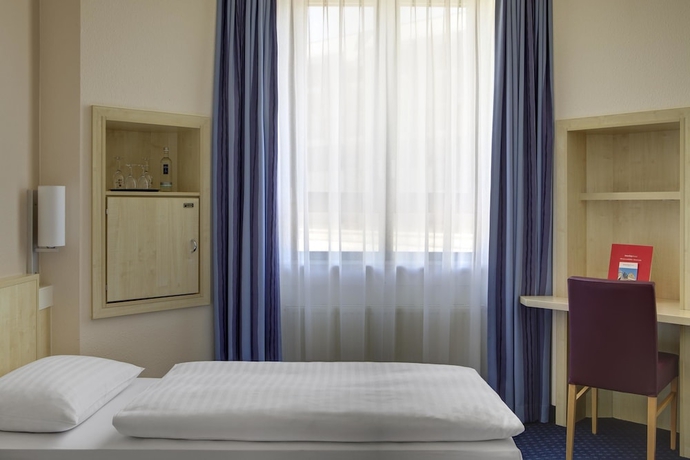 Imagen de la habitación del Hotel Rugs Augsburg City Trademark Collection by Wyndham. Foto 8