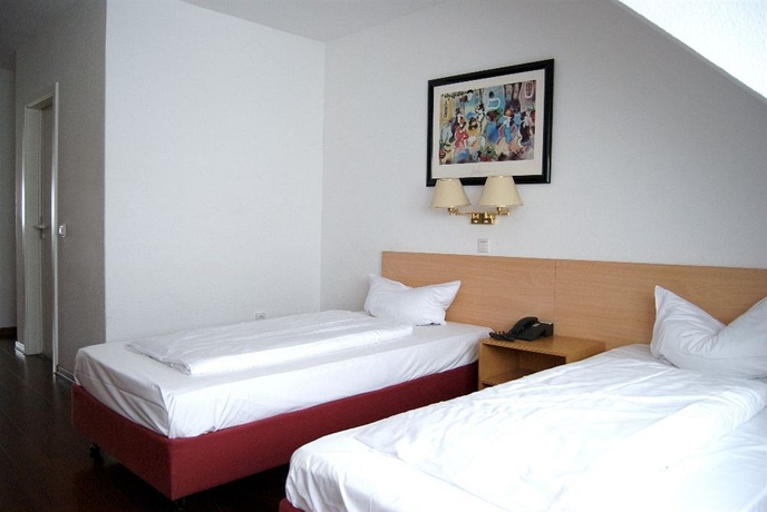 Imagen de la habitación del Hotel Rugs Hotel Düsseldorf. Foto 9