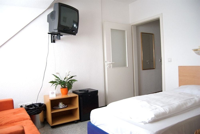 Imagen de la habitación del Hotel Rugs Hotel Düsseldorf. Foto 11