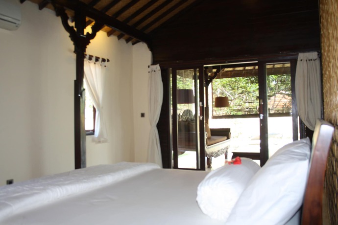 Imagen de la habitación del Hotel Rumah Dadong. Foto 12