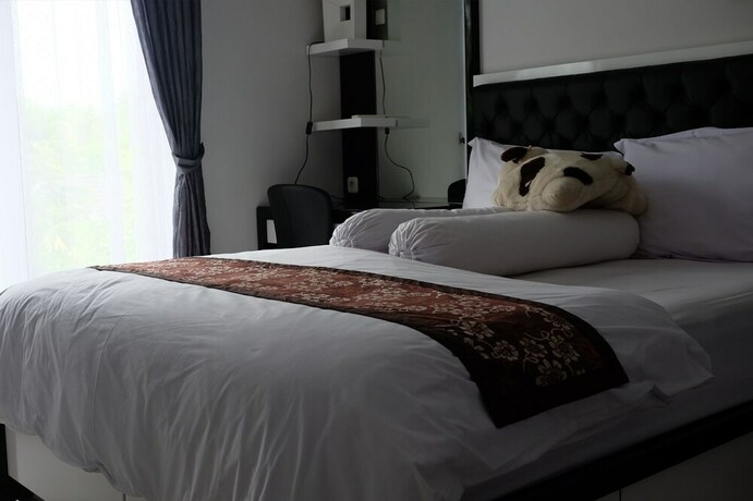 Imagen de la habitación del Hotel Rumah Kecil Jatirejo. Foto 15