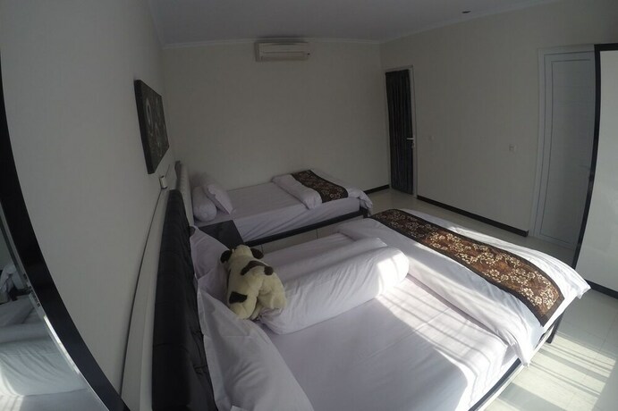 Imagen de la habitación del Hotel Rumah Kecil Jatirejo. Foto 16