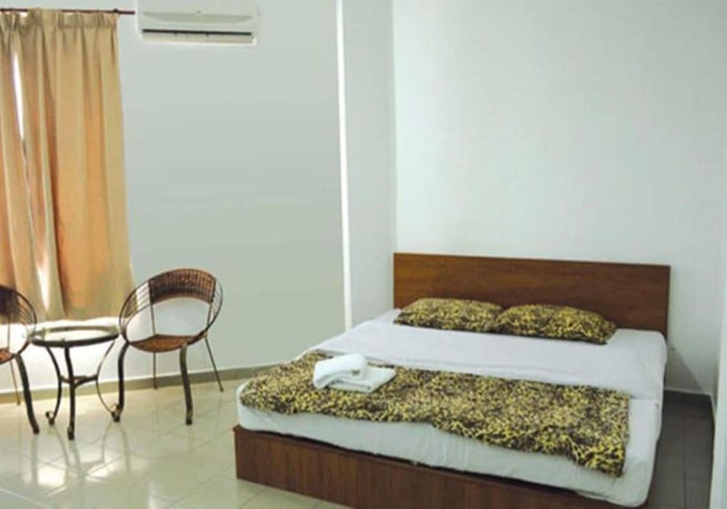 Imagen de la habitación del Hotel Rumah Tumpangan Abby. Foto 12
