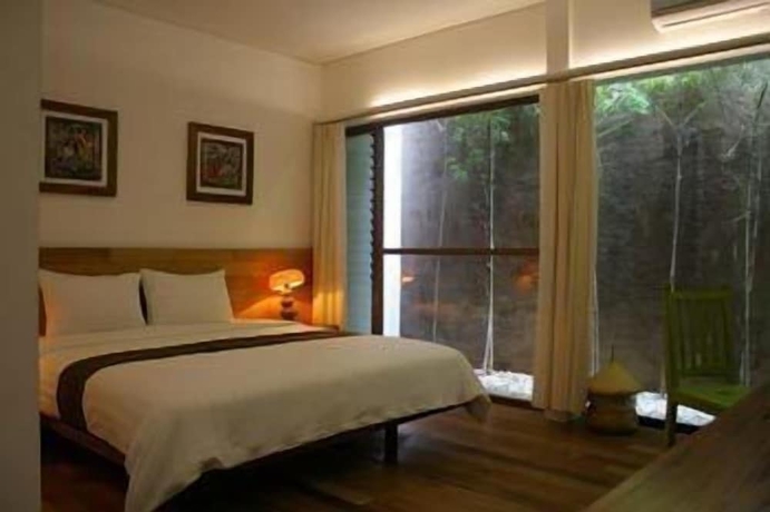 Imagen de la habitación del Hotel Rumah Turi Eco. Foto 11