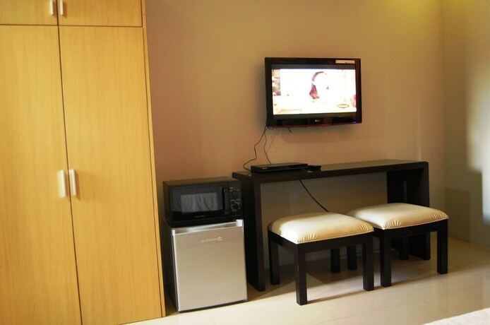 Imagen de la habitación del Hotel Rumi Apartelle. Foto 16