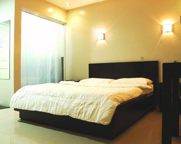 Imagen de la habitación del Hotel Rumi Apartelle. Foto 20