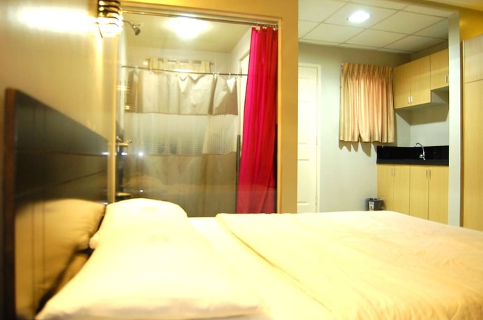 Imagen de la habitación del Hotel Rumi Apartelle. Foto 28