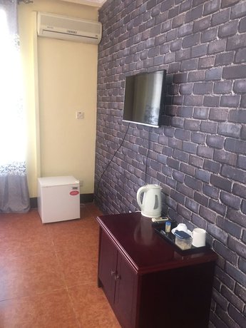 Imagen de la habitación del Hotel Rungwe Palace. Foto 15