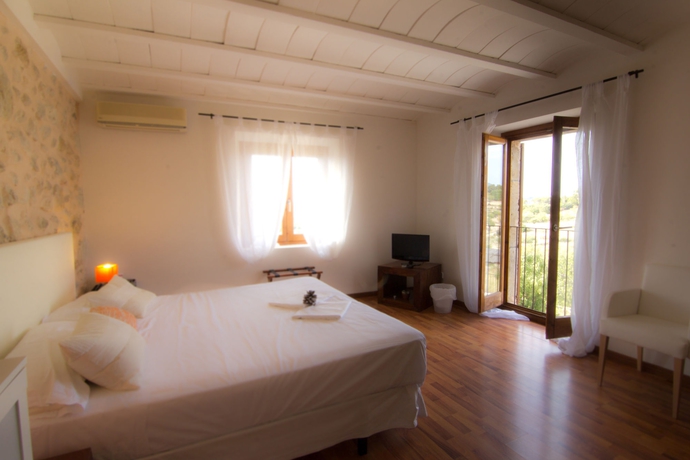 Imagen de la habitación del Hotel Rural Can Calco Petit. Foto 8