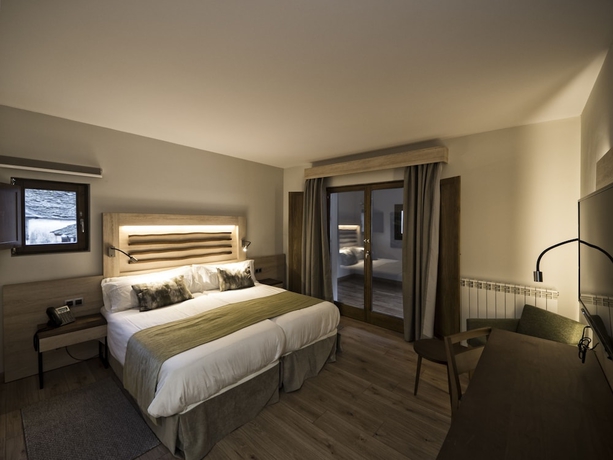 Imagen de la habitación del Hotel Rural Las Montañas de Pumar. Foto 12