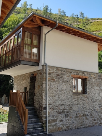 Imagen de la habitación del Hotel Rural Las Montañas de Pumar. Foto 16