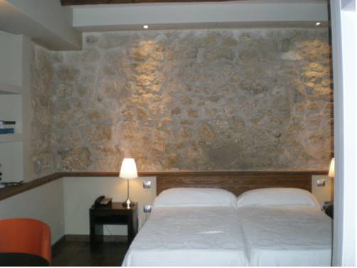 Imagen de la habitación del Hotel Rural Posada la Casona de Valbuena. Foto 7