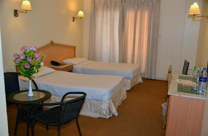 Imagen de la habitación del Hotel Rush Inn. Foto 9