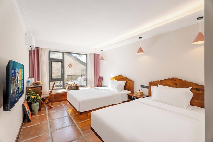 Imagen de la habitación del Hotel SAI JIA HOTEL. Foto 2