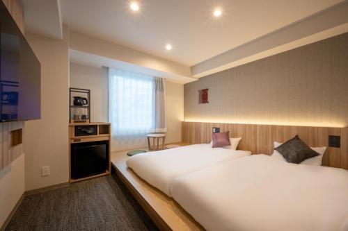 Imagen de la habitación del Hotel SAKURA PORT HOTEL. Foto 16