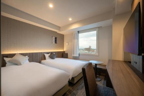 Imagen de la habitación del Hotel SAKURA PORT HOTEL. Foto 17