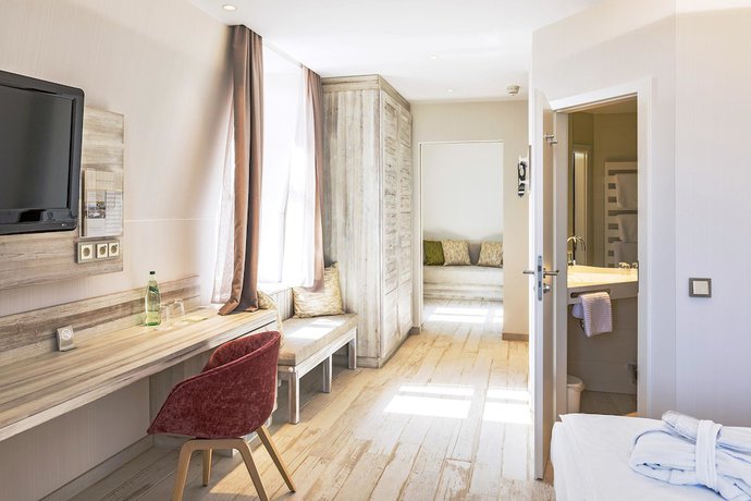 Imagen de la habitación del Hotel SEETELHOTEL Strandhotel Atlantic. Foto 3