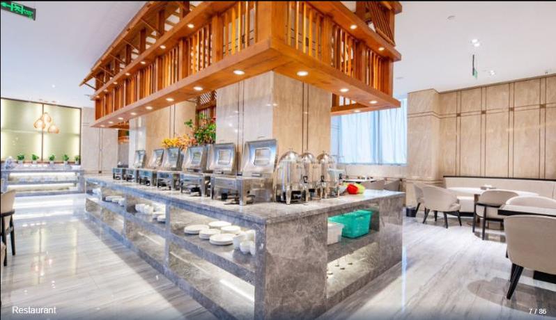 Imagen del bar/restaurante del Hotel SHITING ZHOUJI HOTEL. Foto 5