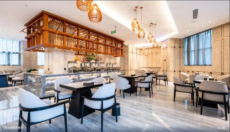 Imagen del bar/restaurante del Hotel SHITING ZHOUJI HOTEL. Foto 6