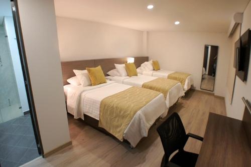 Imagen de la habitación del Hotel SM Grand. Foto 8